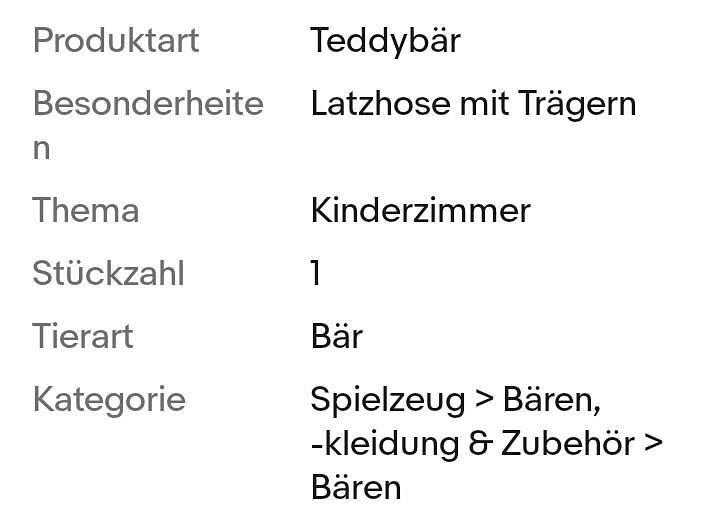 Bild 2 gehäkelter Teddybär, der eine grüne Latzhose trägt